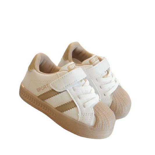 Baby velcro sneakers, white and khaki upper with gum sole, angled studio view.