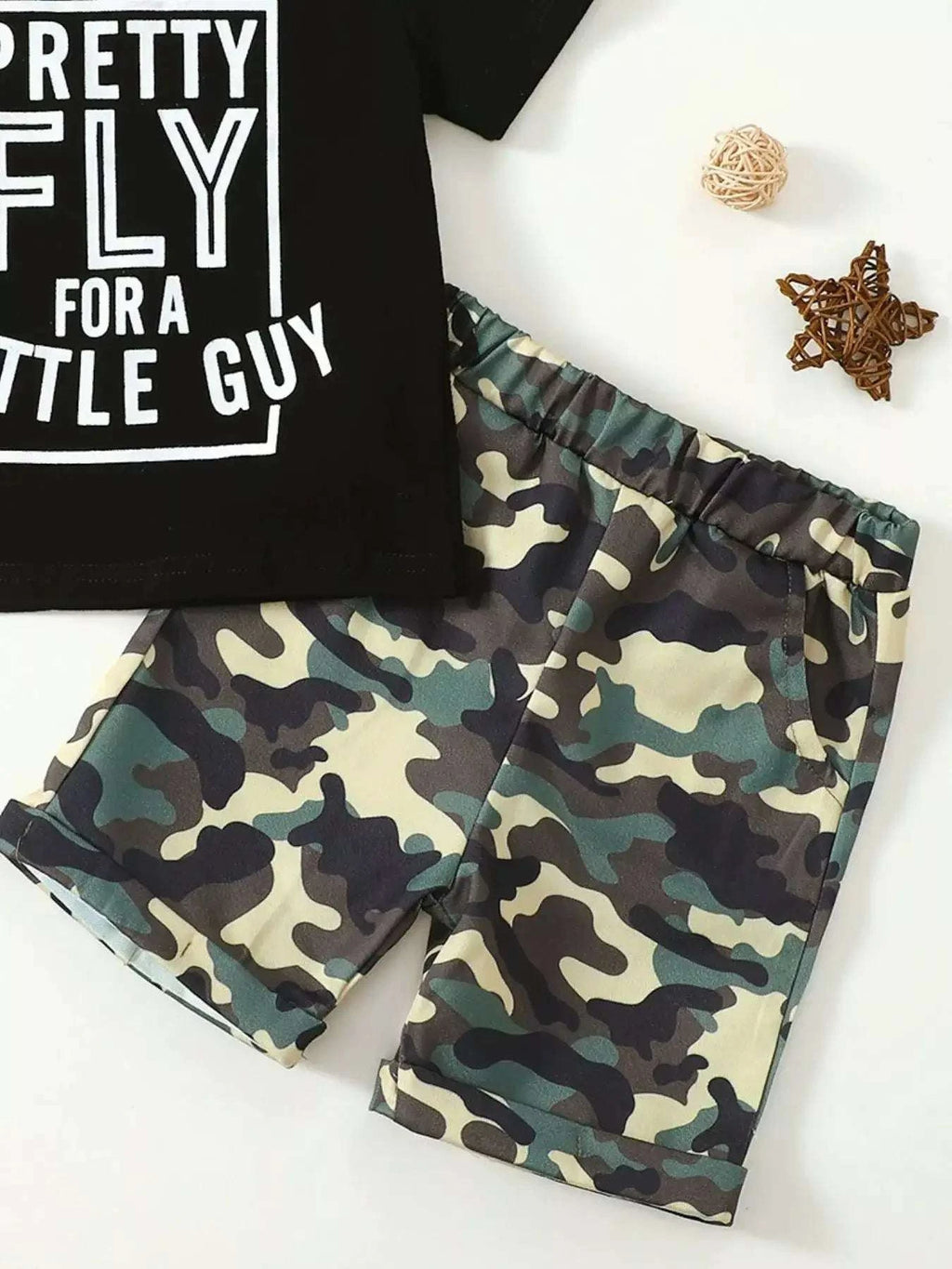 Kids black graphic tee and camouflage shorts set, close view of "PRETTY FLY" print