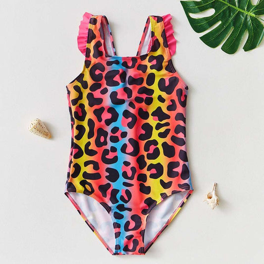 Kids one-piece swimsuit with ruffled shoulder straps in colorful leopard print