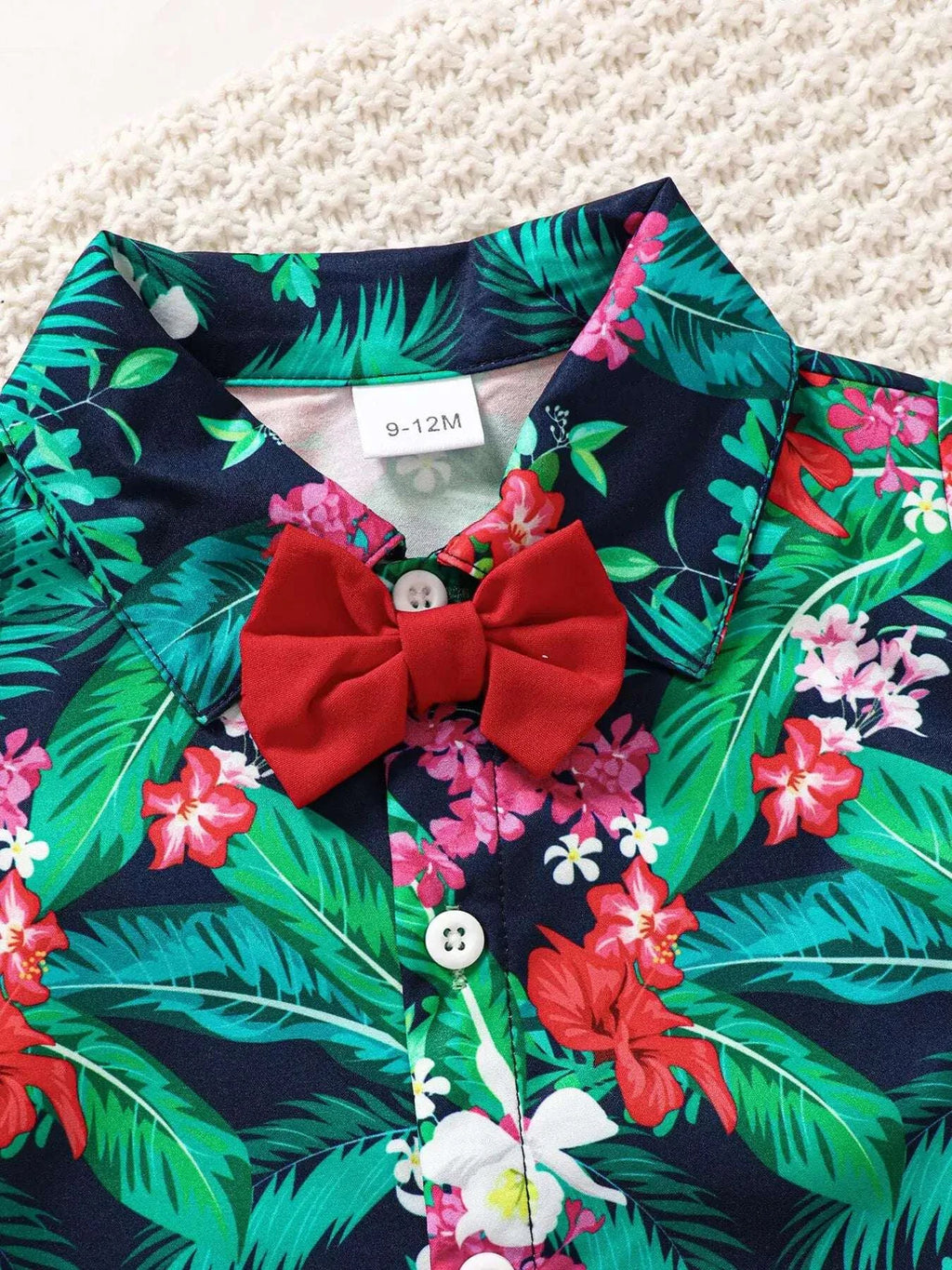 Kids tropical print shirt with red bow, floral buttons, and collar
