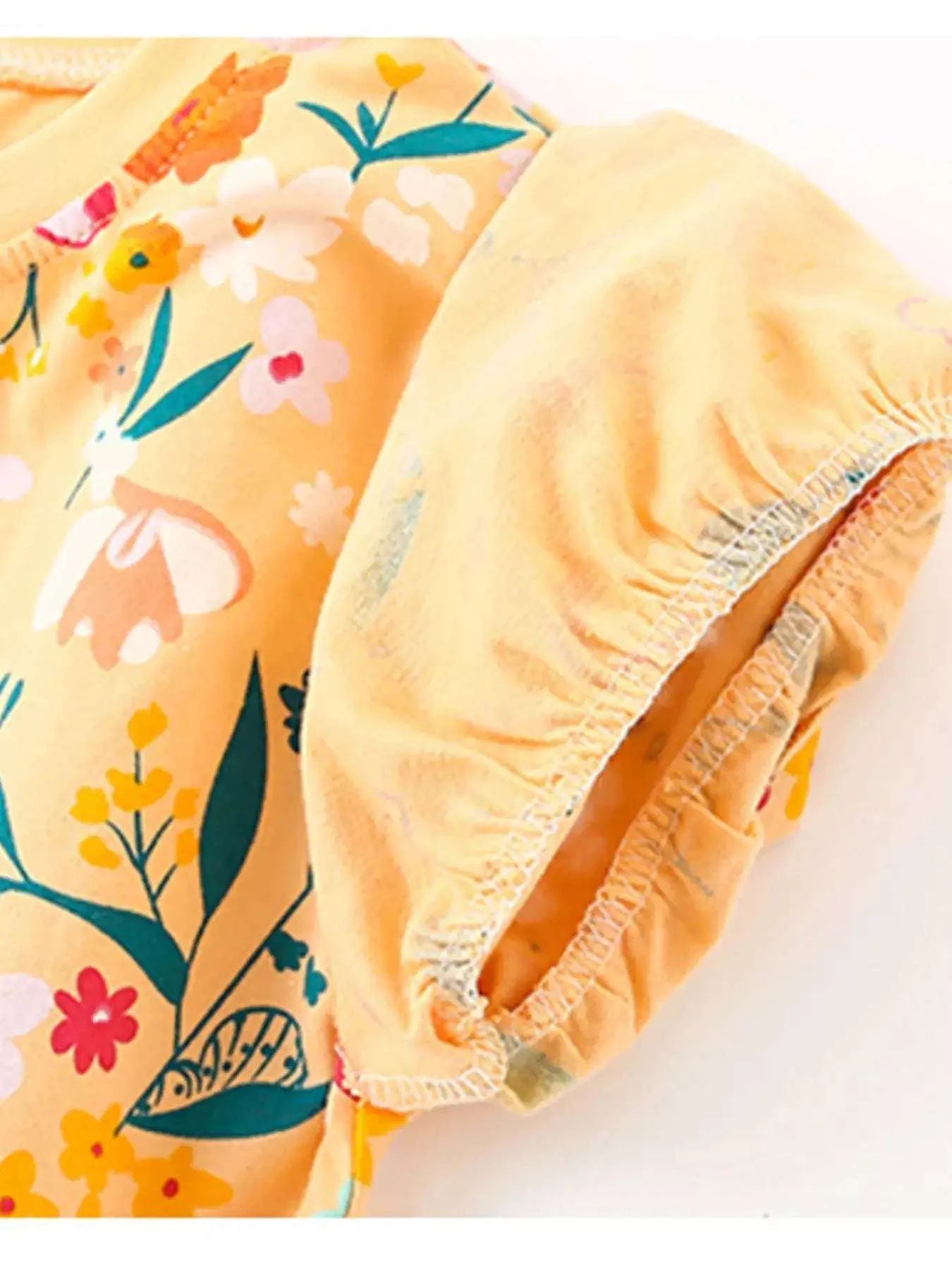 Kids shorts with elastic waist and ruffle-trim hem, colorful floral print