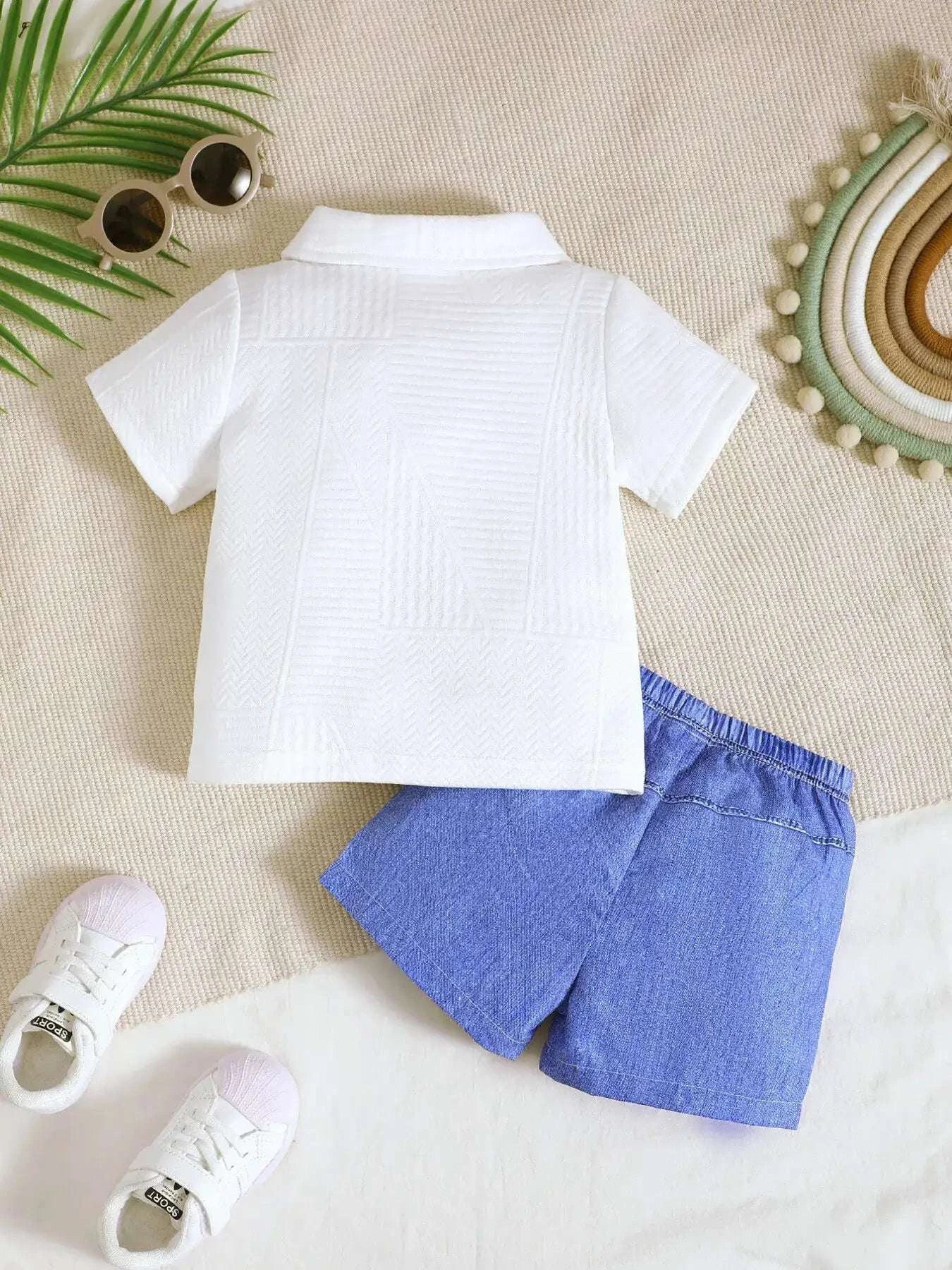 White textured polo shirt back with pointed collar; blue denim ripped shorts