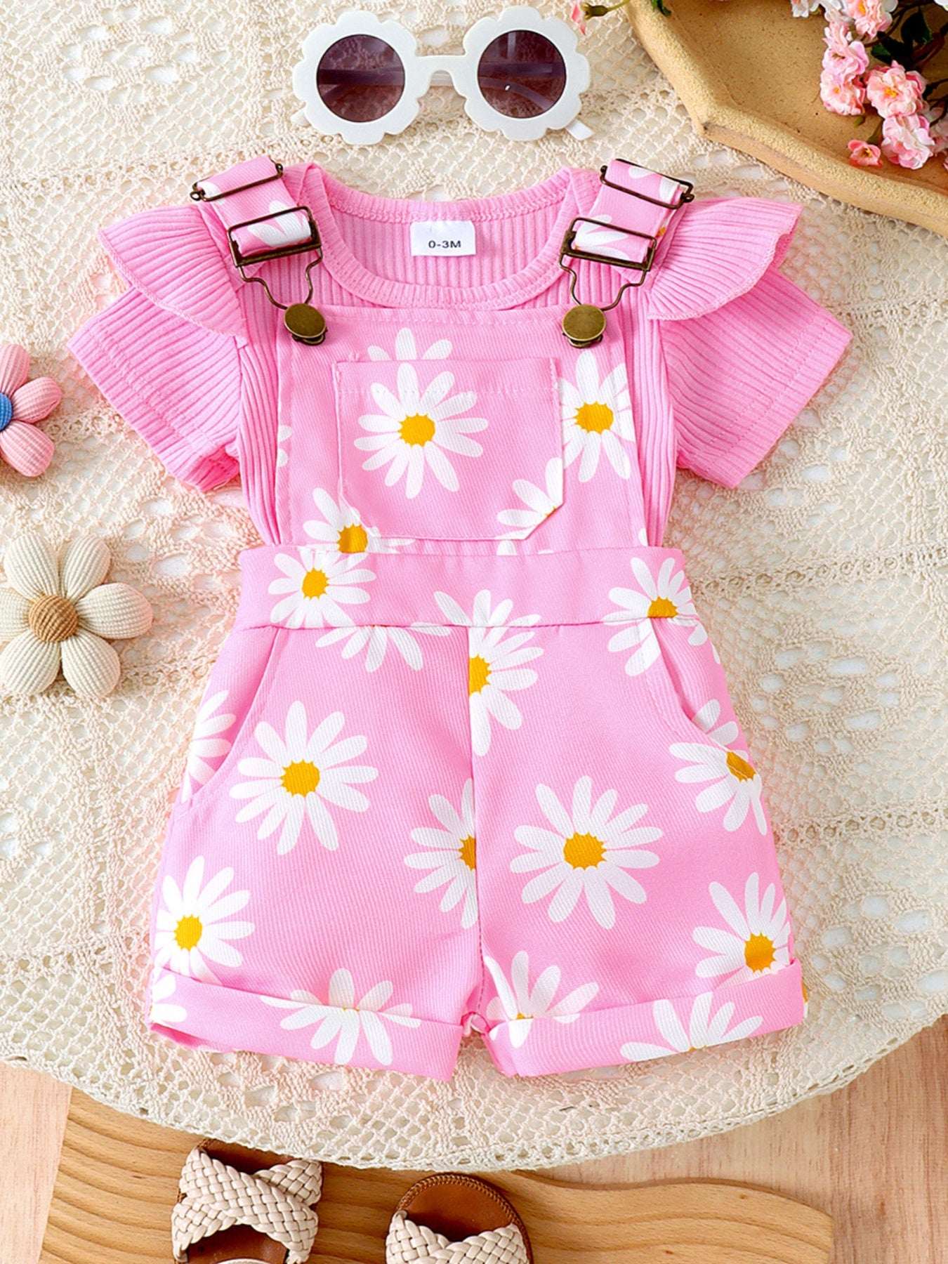 Pink daisy ruffle-trim ribbed top and short overalls set with daisy print