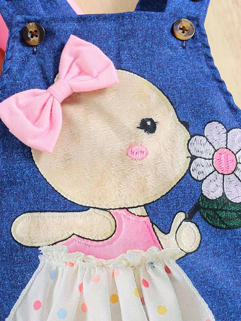 Children's overall dress with bunny and flower embroidery, pink bow, and polka dot skirt