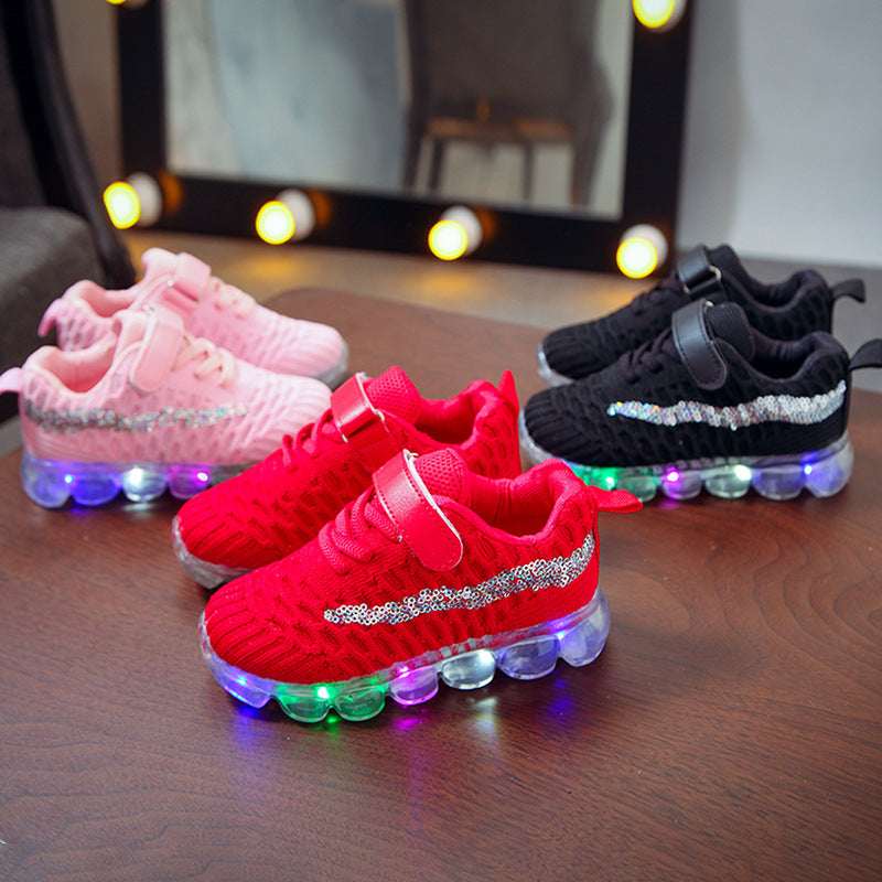 Kids' LED light sneakers set: pink, red, and black, hook-and-loop straps, glowing soles