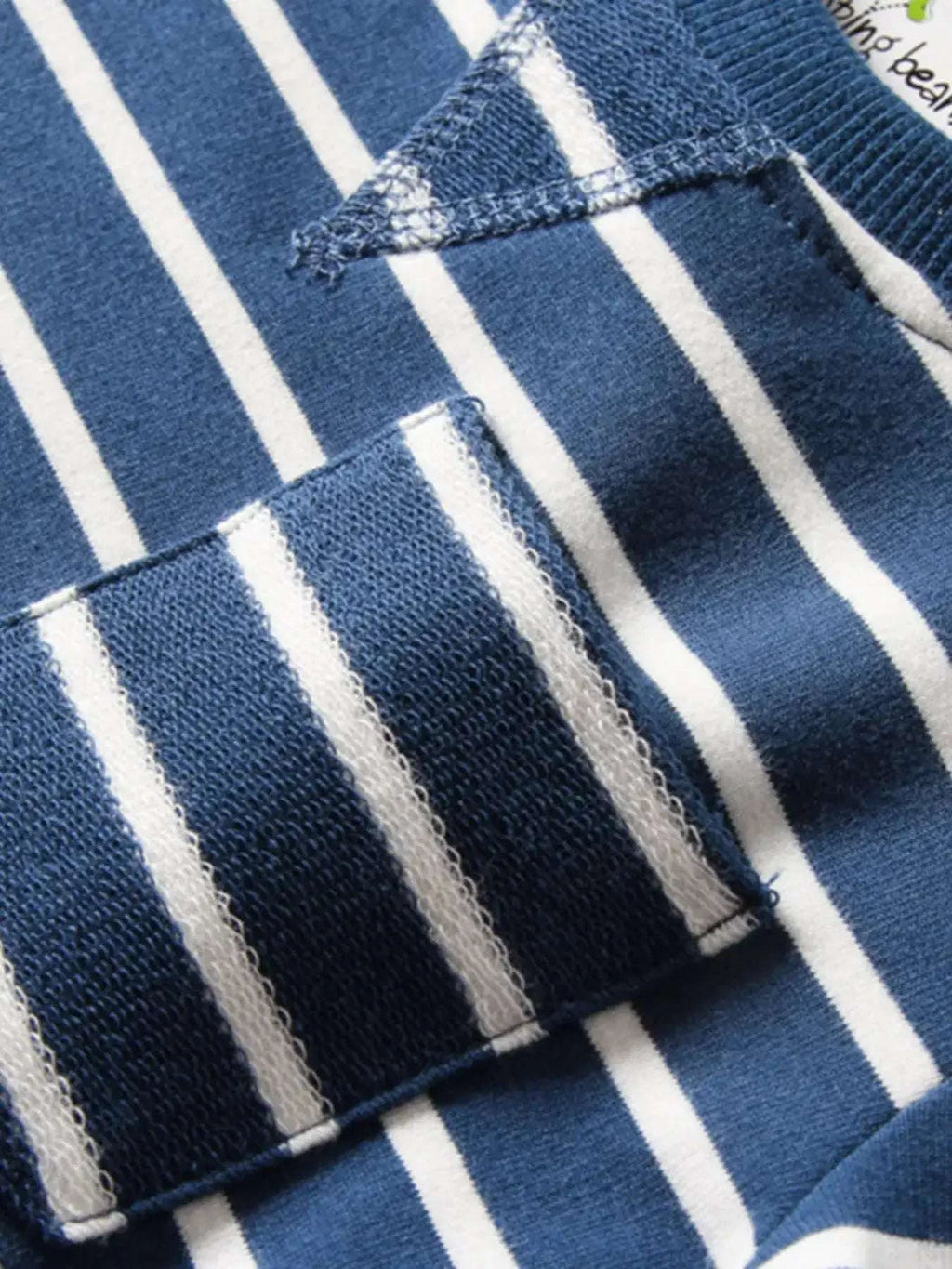 Dark blue and white striped t-shirt fabric with stitched hem