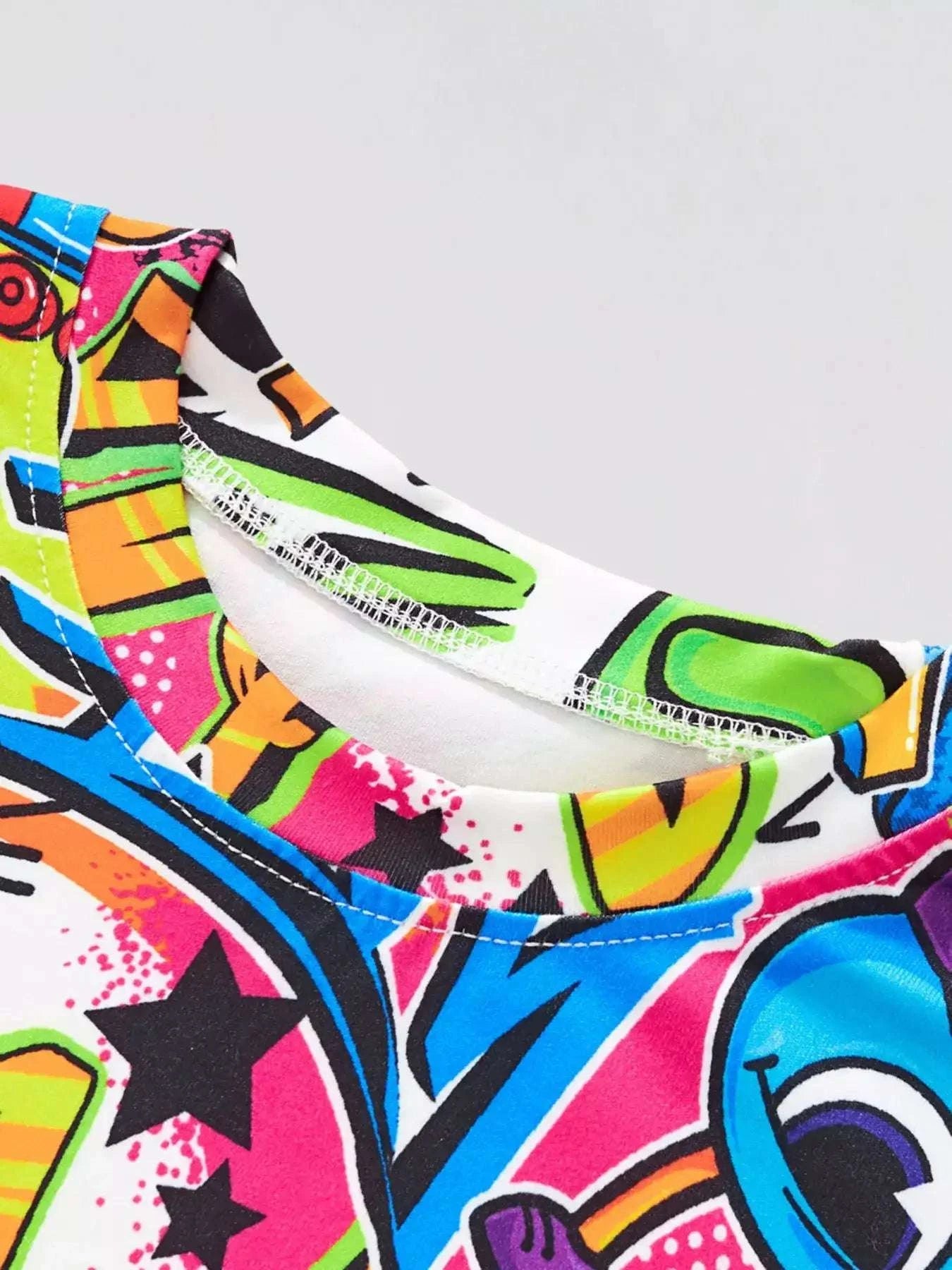 Kids graffiti T-shirt neckline close-up with colorful print and ribbed collar