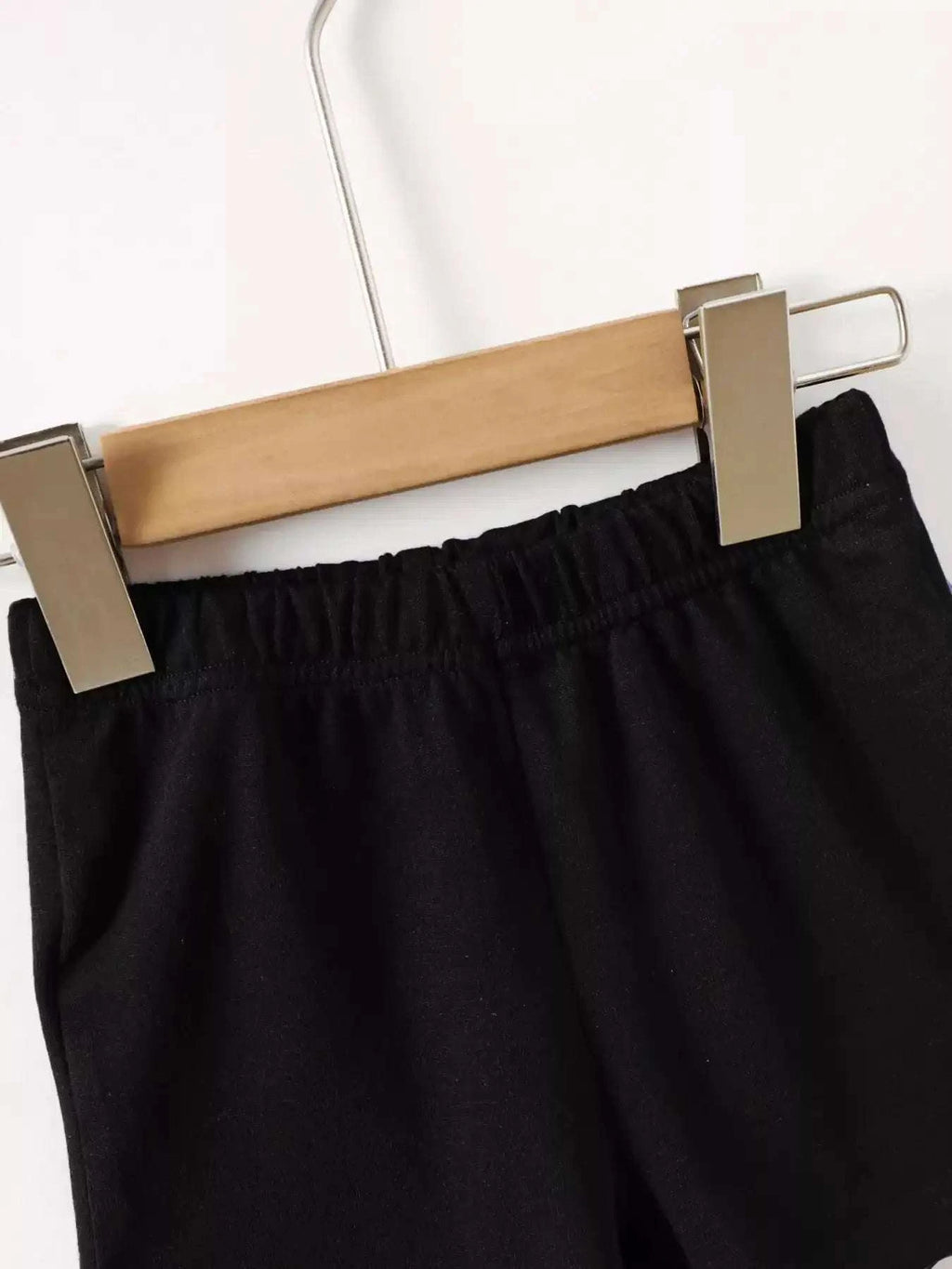 Black kids shorts with elastic waistband.