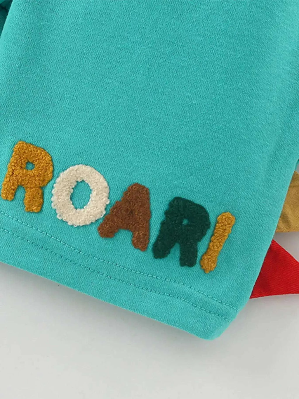 Kids turquoise graphic applique tee with multicolor letters at the hem