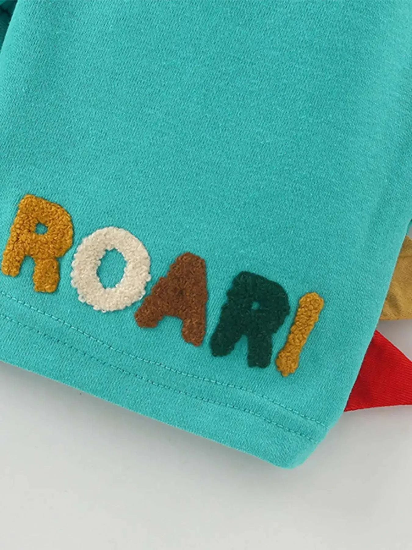Kids turquoise graphic applique tee with multicolor letters at the hem