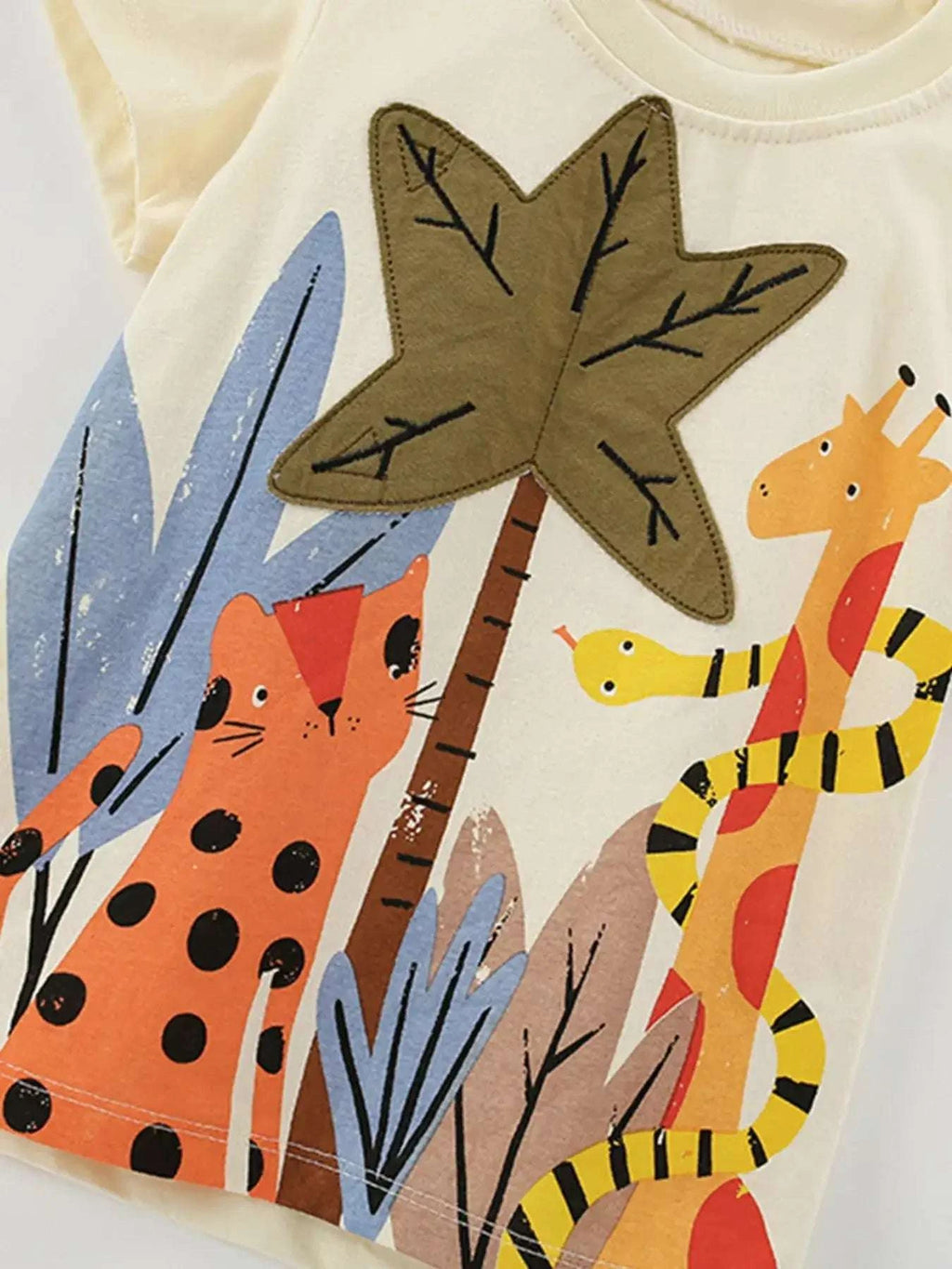 Kids beige t-shirt with tropical animals and plants front graphic
