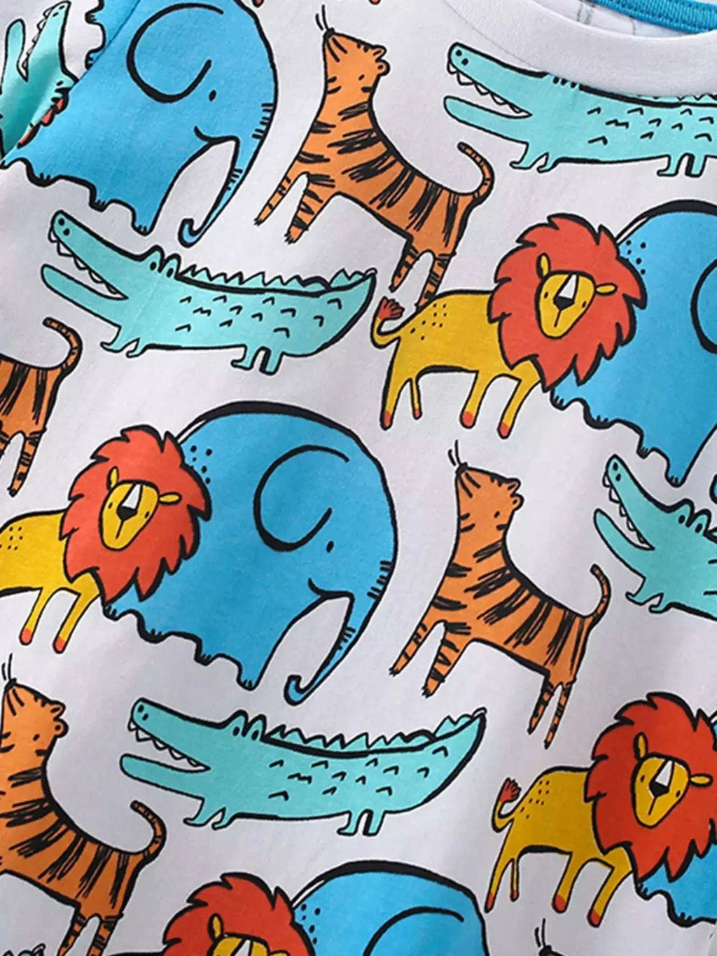 Animal print tee fabric close-up with blue elephants, orange lions, and teal reptiles