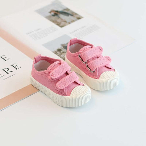 Baby canvas sneakers with hook-and-loop straps, pink uppers and white sole