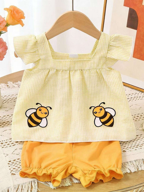 Light yellow kids top and shorts set with bee embroidery and ruffle sleeves