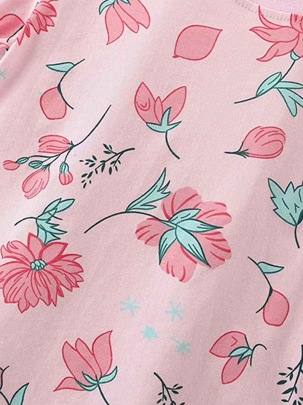 Blush pink kids short-sleeve tee with allover red and teal flower pattern