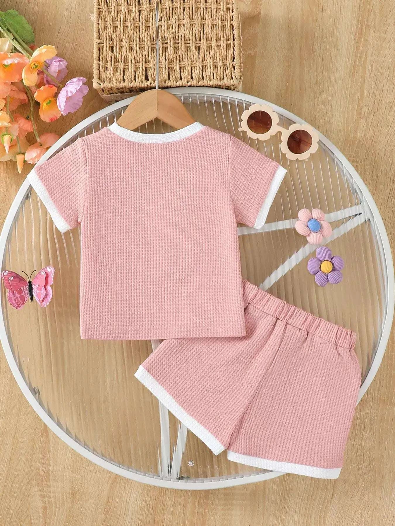 Pink waffle-knit long-sleeve style tee and shorts set with elastic waistband