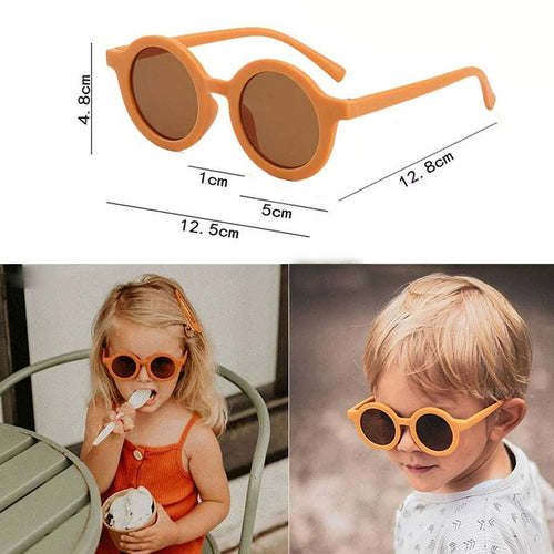 Kids round sunglasses with orange frame and brown tinted lenses, wide curved temples.