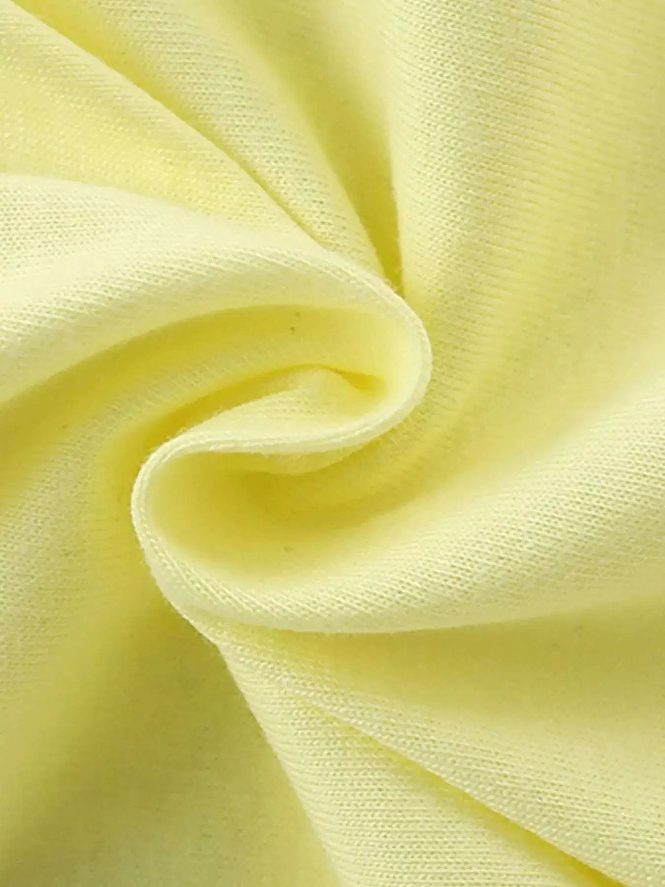 Light yellow kids T-shirt fabric close-up, soft jersey knit