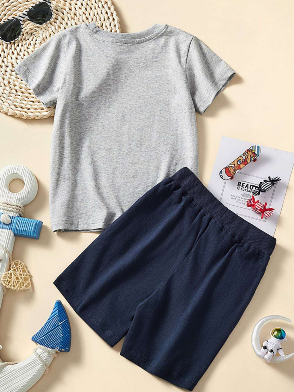 Children's gray tee and navy shorts set with ship graphic, front view