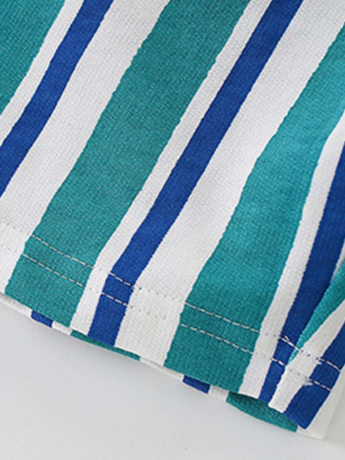 Children's striped shorts hem detail with stitched edge and aqua-blue stripes