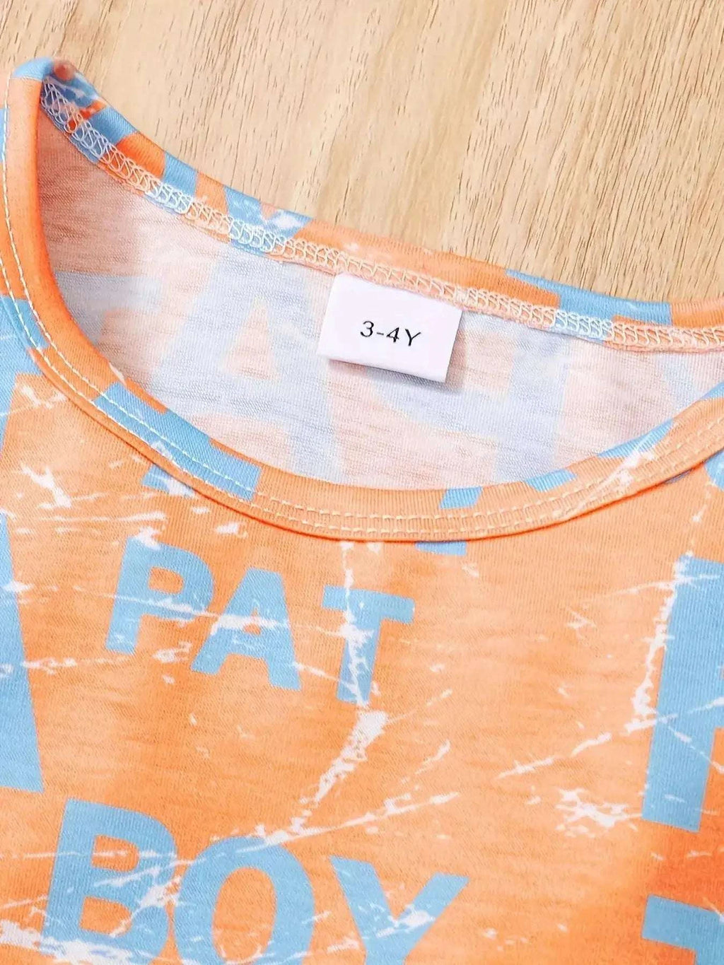 Orange T-shirt crew neck with blue letter print and size tag 3-4Y