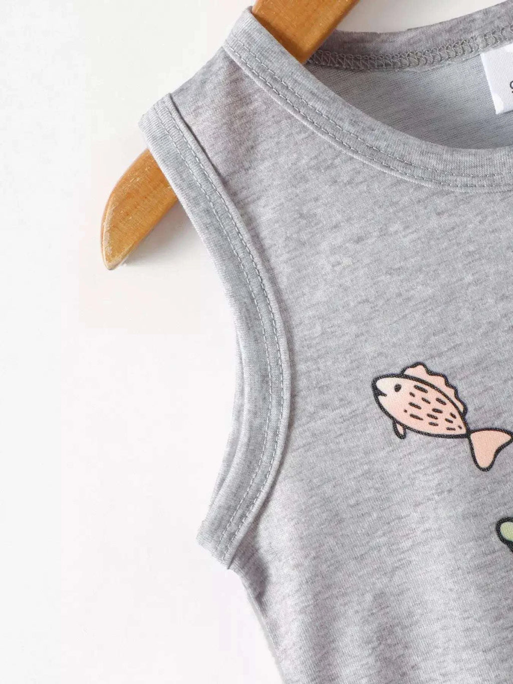 Gray tank top with fish graphic detail along the front and crew neck.