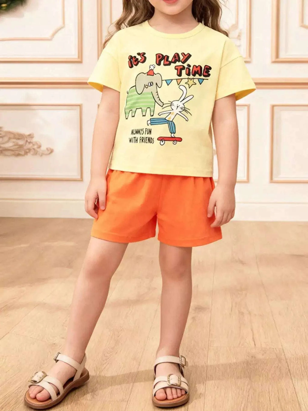 Yellow cartoon graphic top and orange shorts set for kids