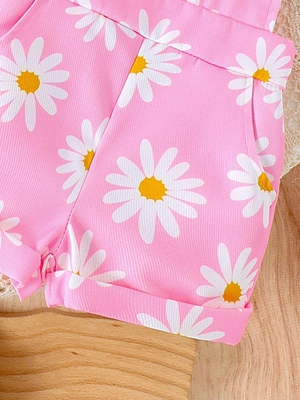 Pink daisy print short overalls with stitched leg hem and side seams