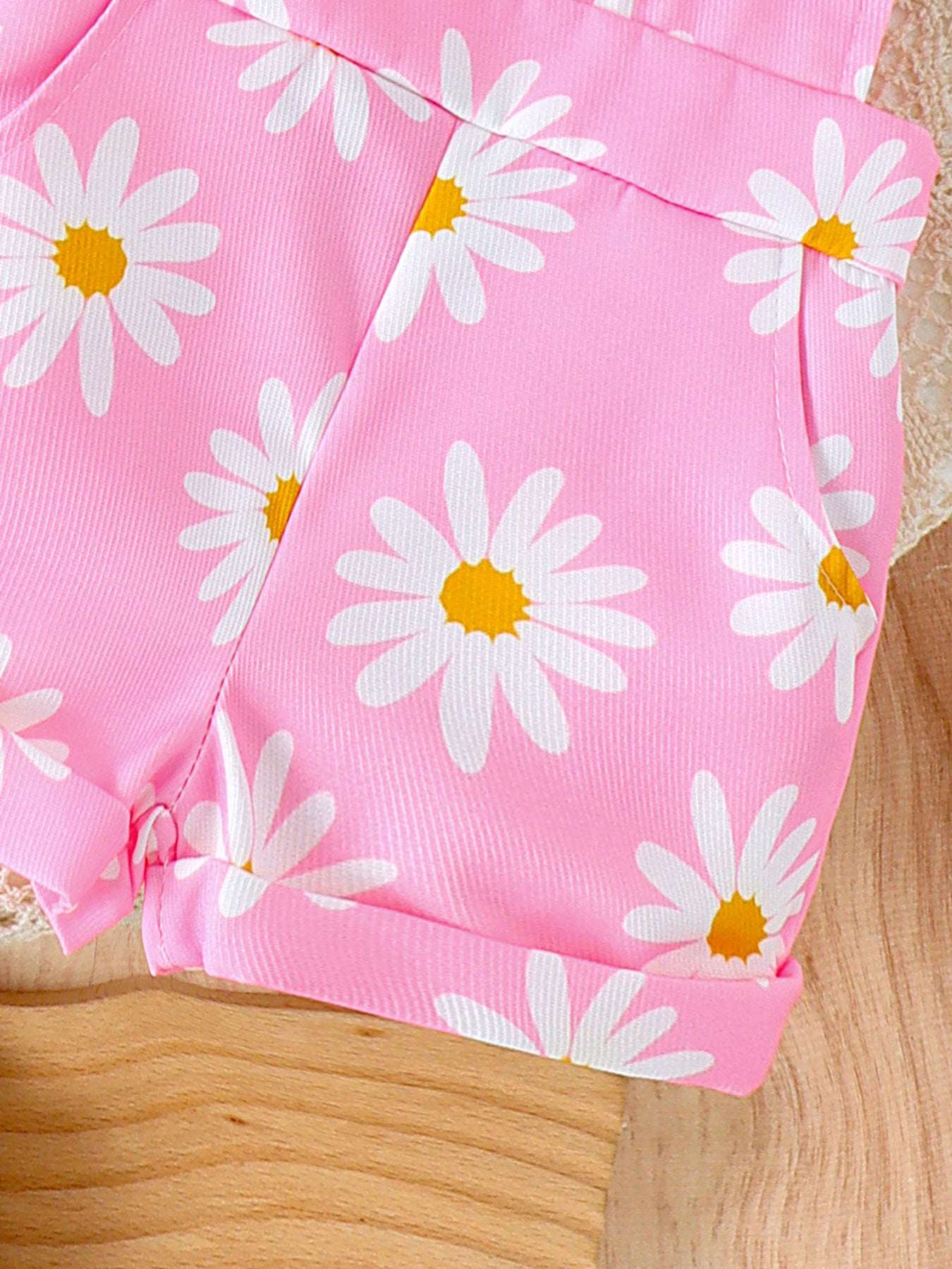 Pink daisy print short overalls with stitched leg hem and side seams