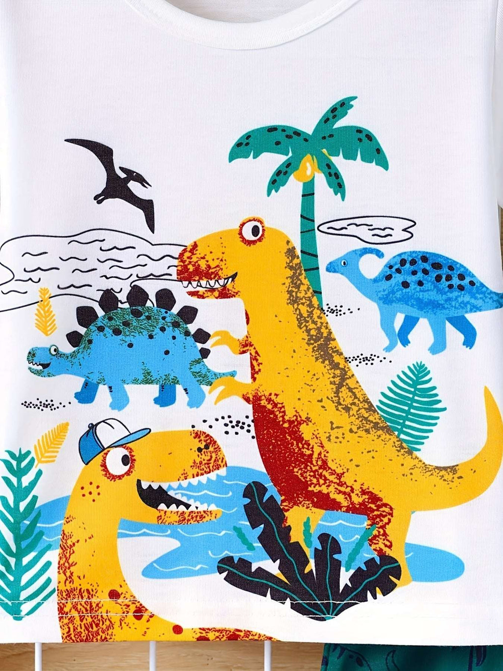 Kids white dinosaur scene short sleeve tee with colorful dino artwork
