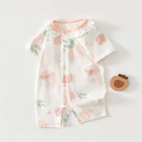 Baby short-sleeve jumpsuit in white with pink floral print, ruffled collar and cuffs