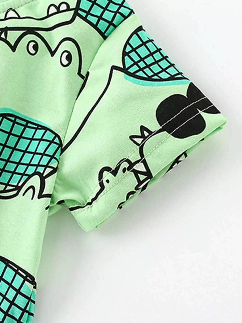 Mint green kids shorts with crocodile scale print and elastic waistband cuff detail