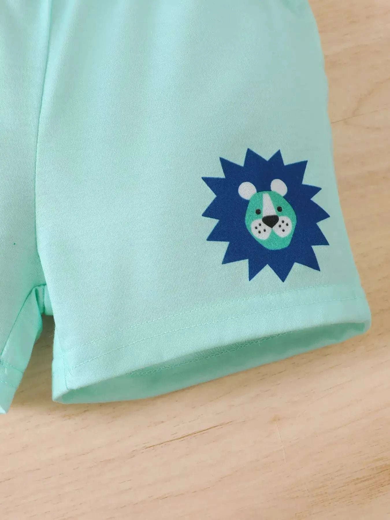 Light blue short-sleeve top with small lion emblem