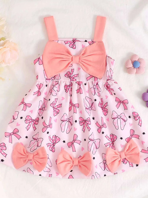 Children's bow-front printed dress in pink with bow detail at chest, sleeveless straps