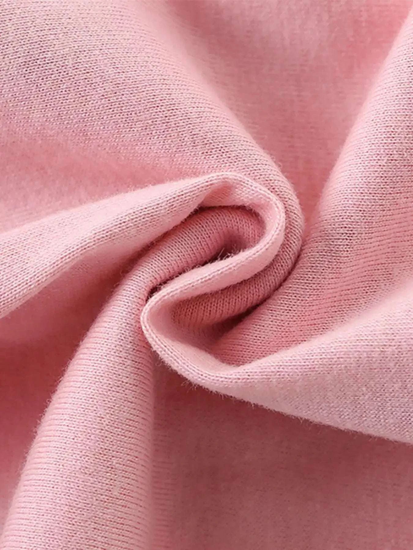 Blush pink kids T-shirt fabric close-up with soft knit texture