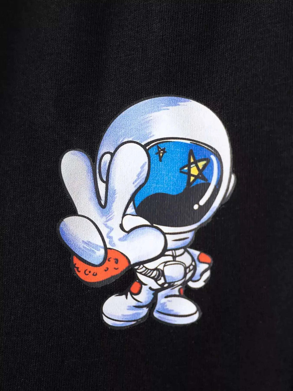 Black short-sleeve tee with astronaut character and space stars graphic