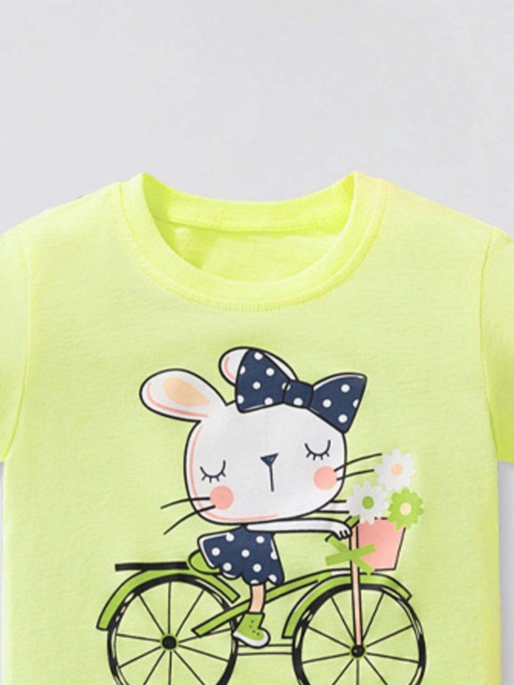 Lime green kids T-shirt, close view of rabbit on bicycle front print