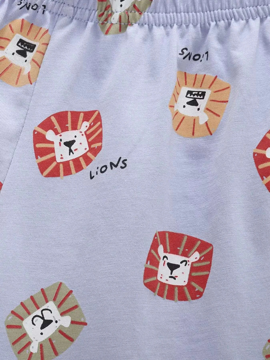 Light blue shorts and tee set with elastic waistband and lion face prints