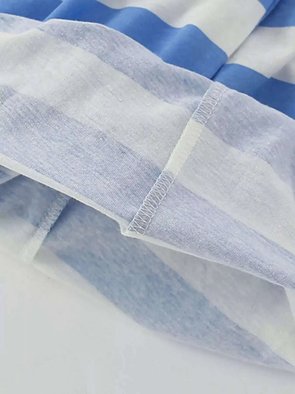 Blue and white striped kids shorts with elastic waistband and stitched hem