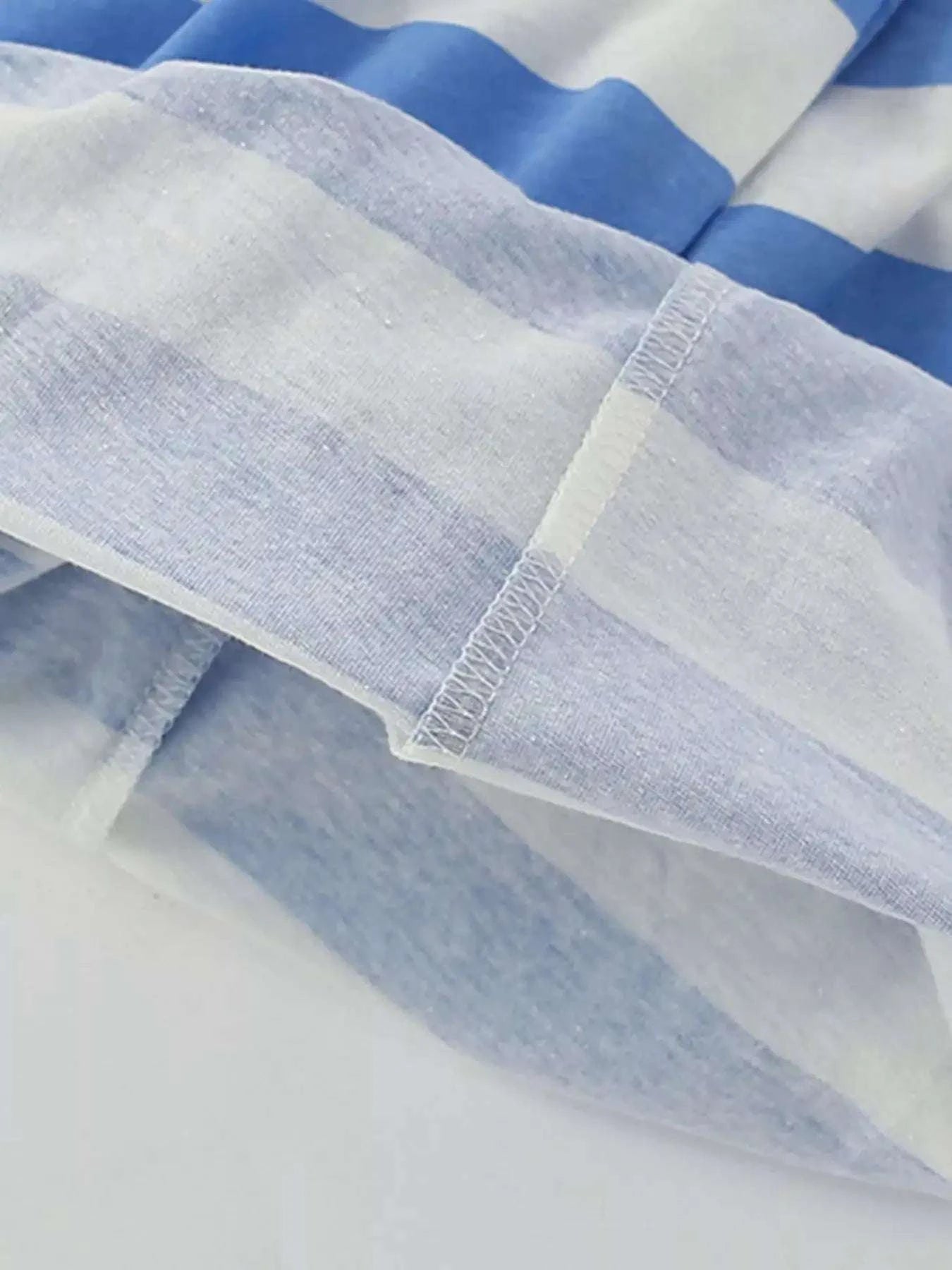 Blue and white striped kids shorts with elastic waistband and stitched hem