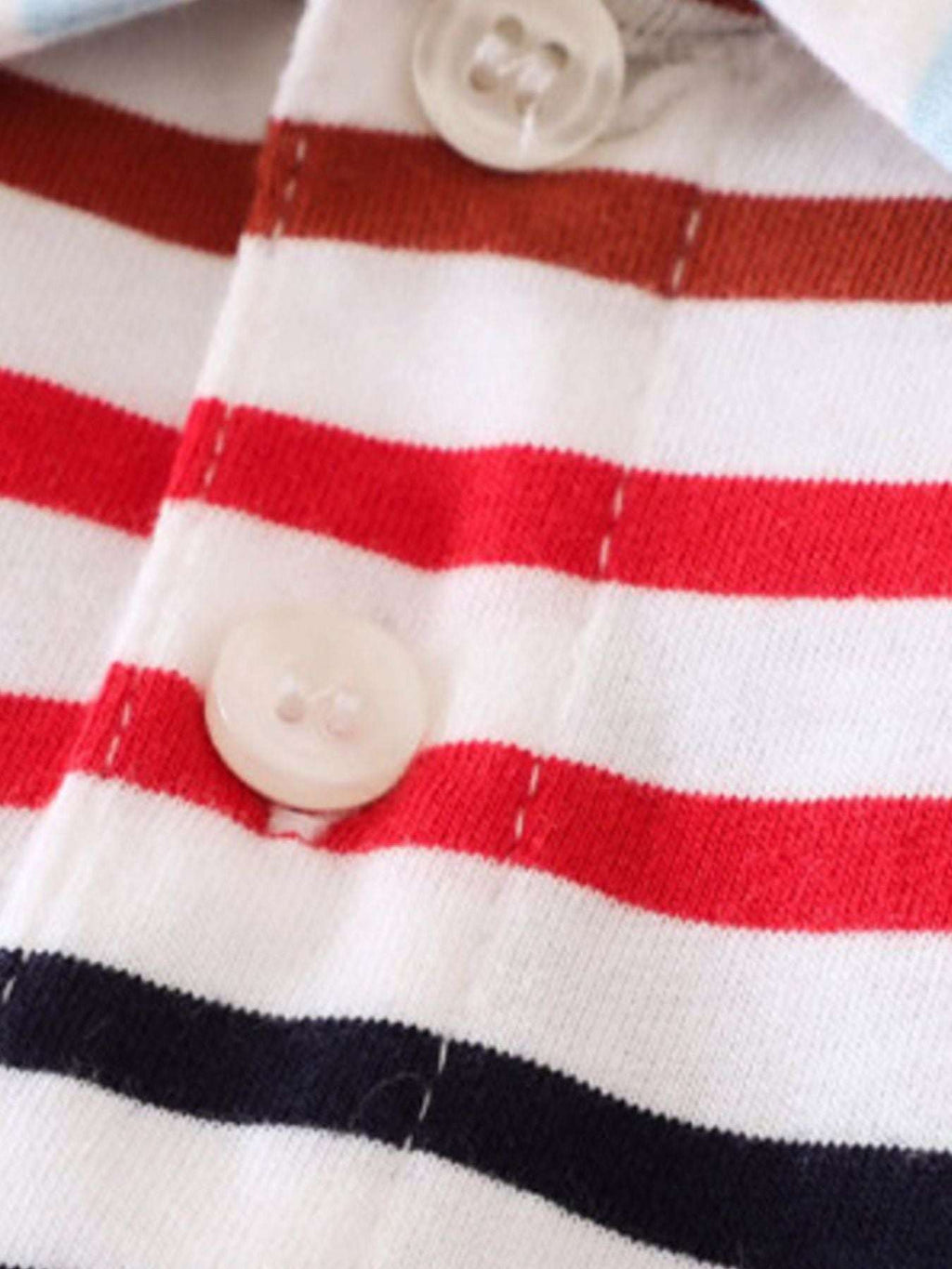 Polo placket close-up with white and red stripes and two white buttons