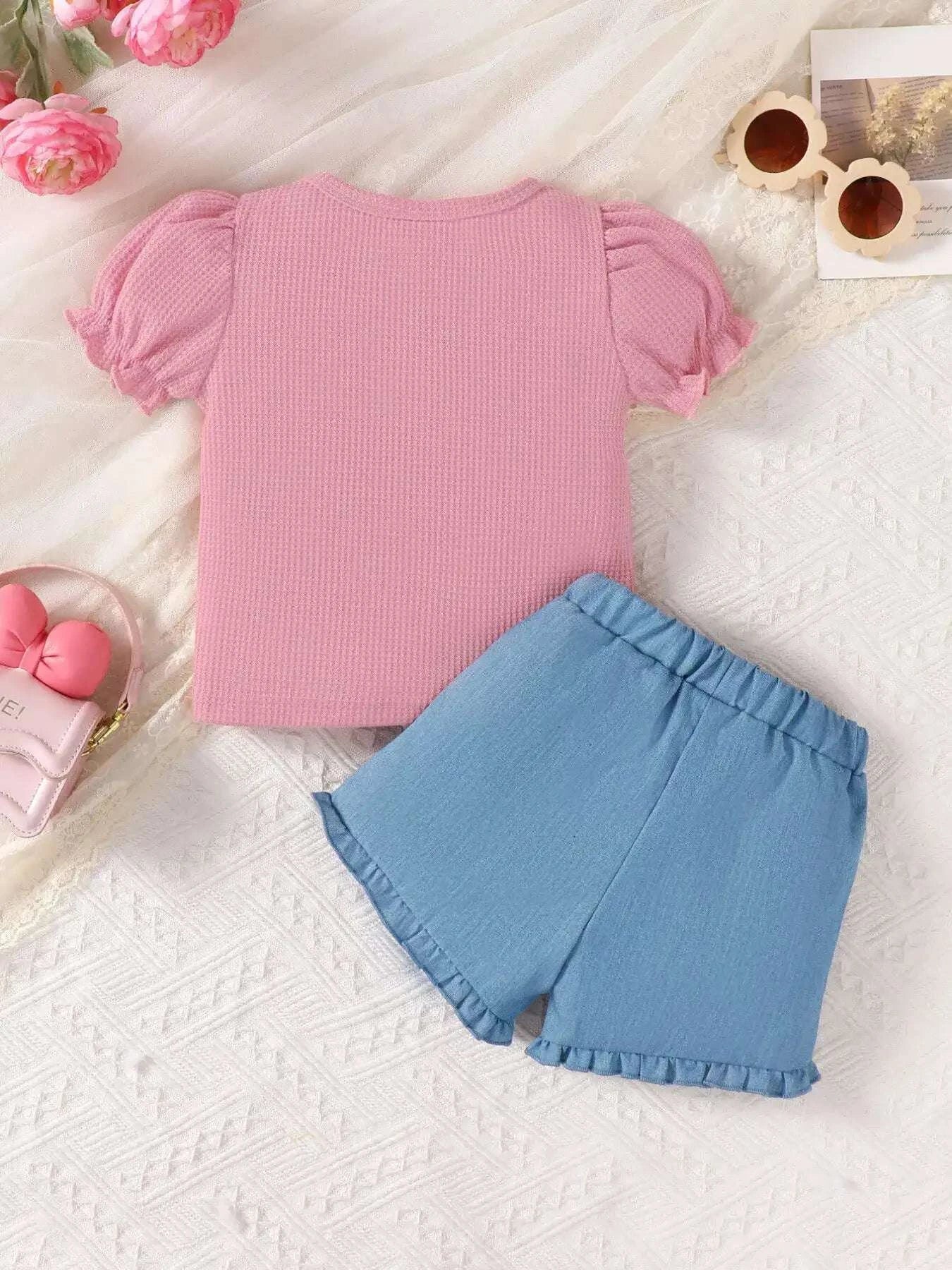 Pink top with puff sleeves and blue ruffle-hem shorts, girls two-piece set