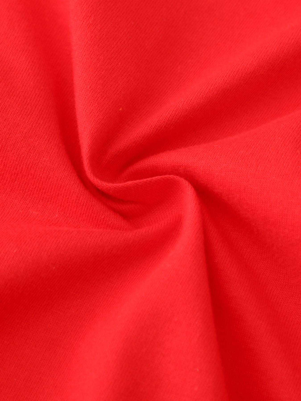 Red knit fabric close-up, soft jersey texture