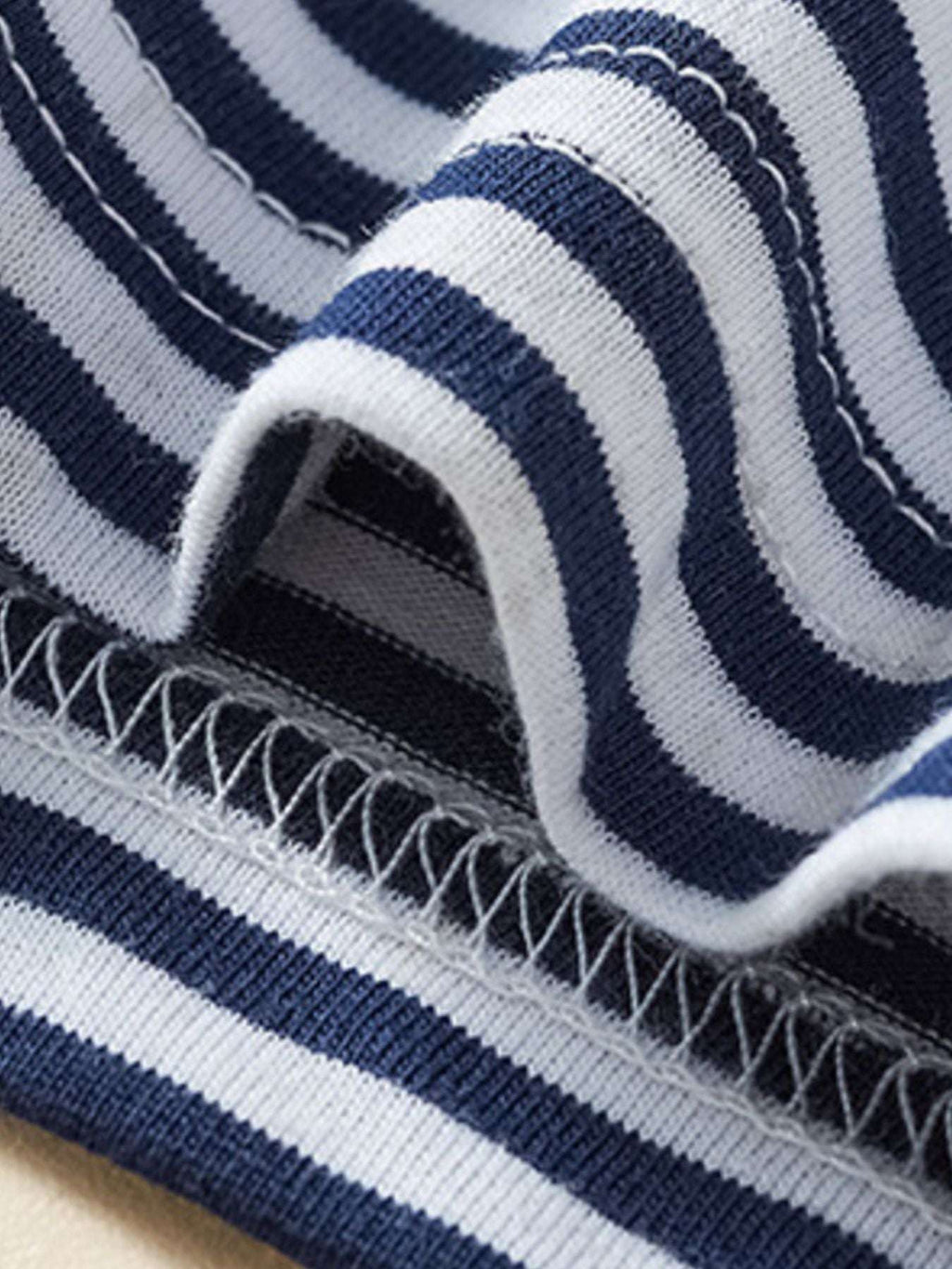 Children's striped polo shirt hem with ribbed trim and stitched edge, navy stripes