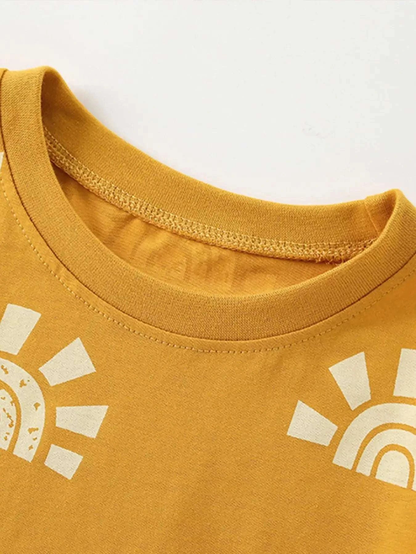 Gold kids short-sleeve tee with ribbed crew neck and white sunburst print