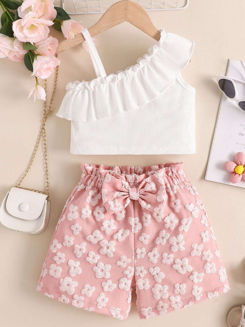 White off-shoulder ruffled top with pink floral shorts and tie-front waistband