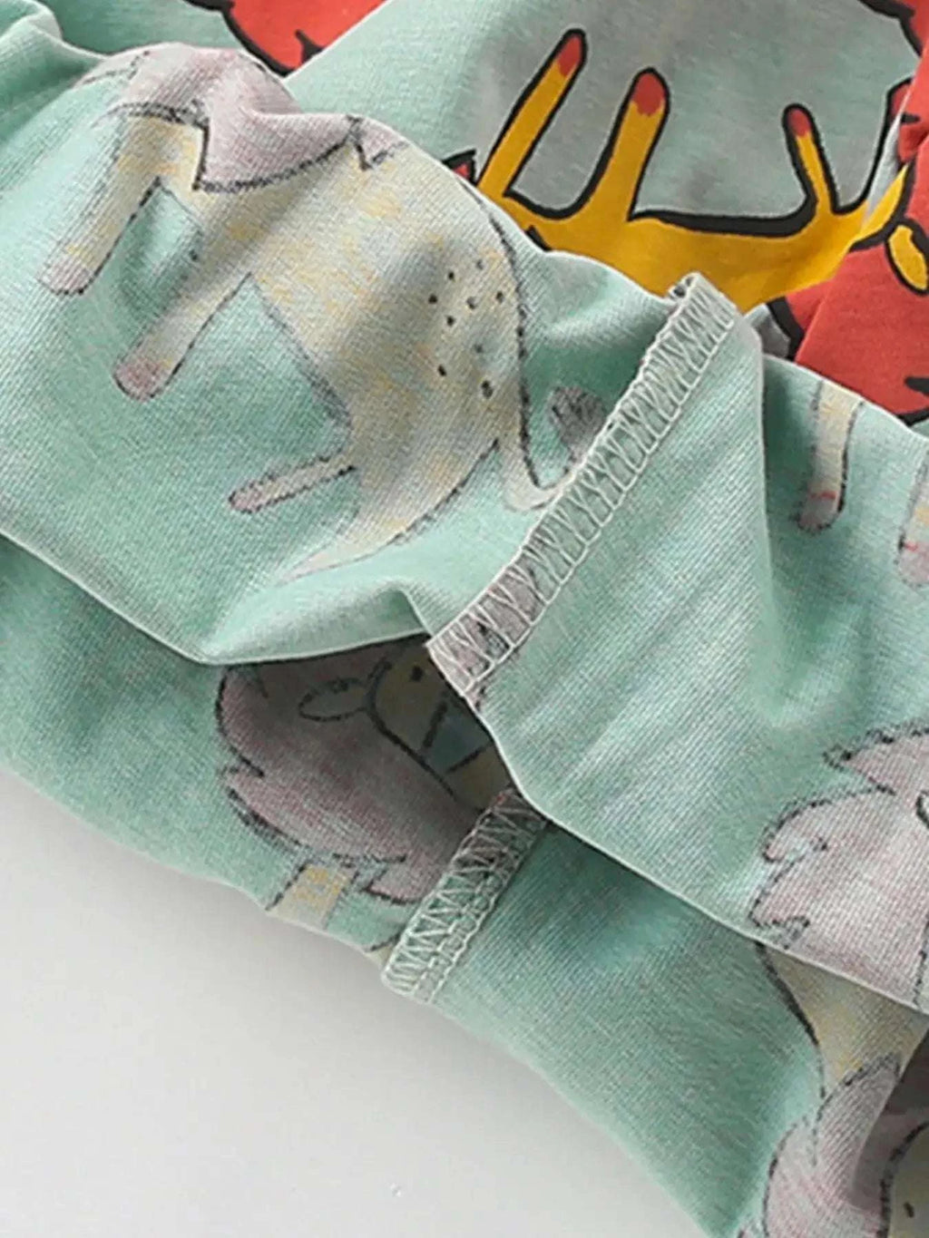 Kids shorts with sage green lion print and elastic waistband