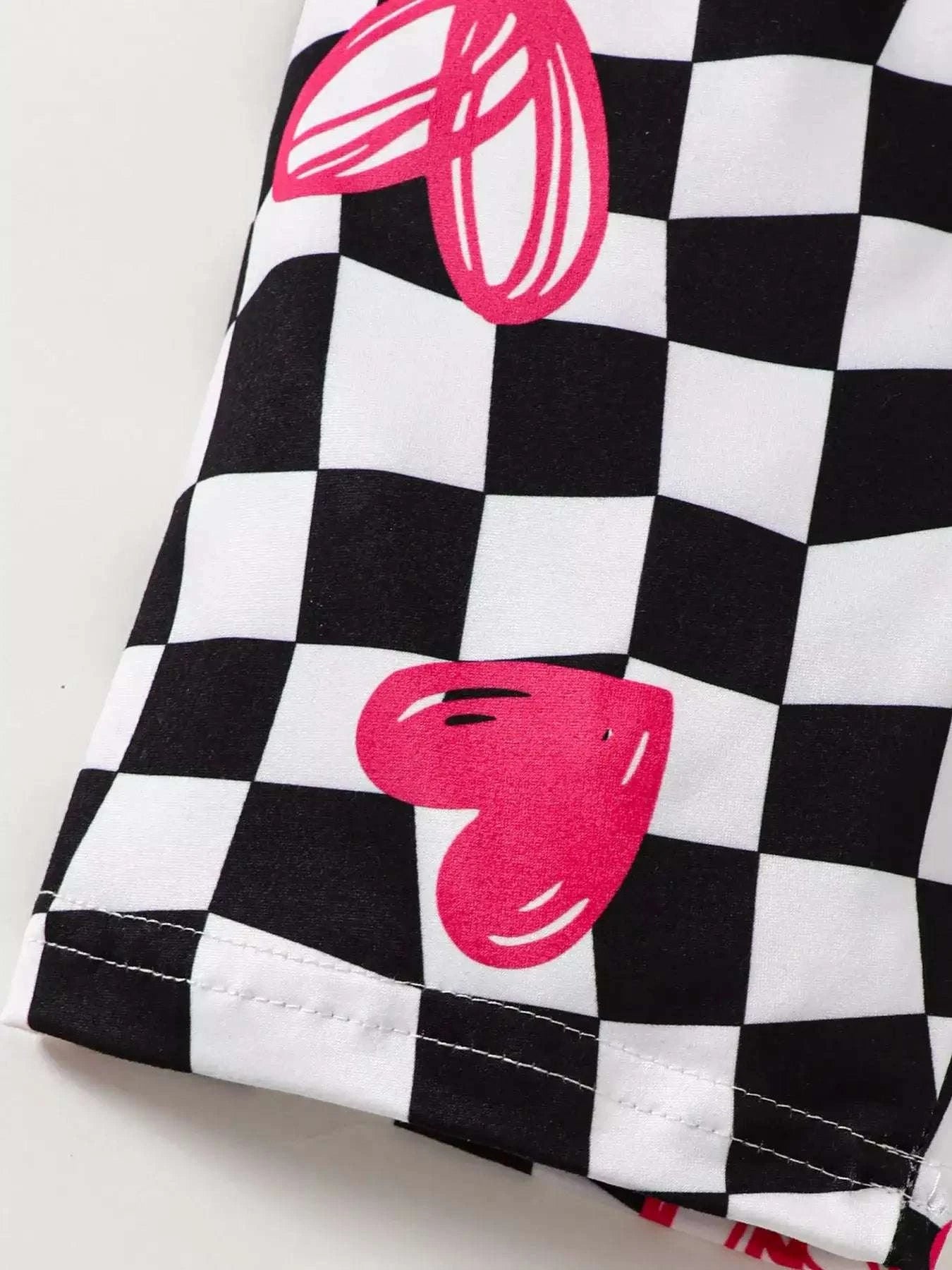 Kids checkerboard shorts with pink heart and mitten prints