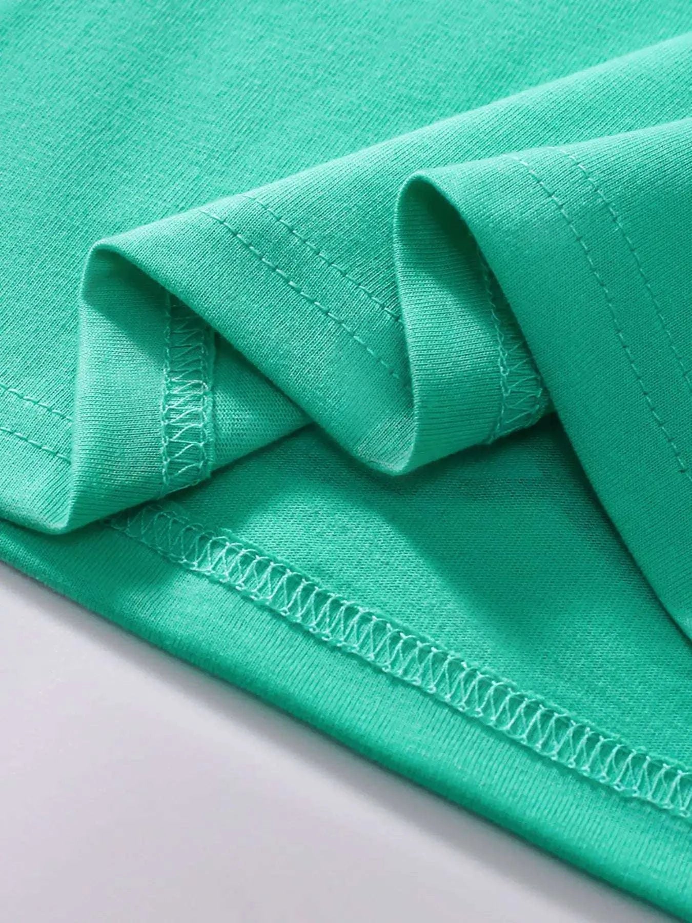Neon green kids T-shirt sleeve and stitched hem detail