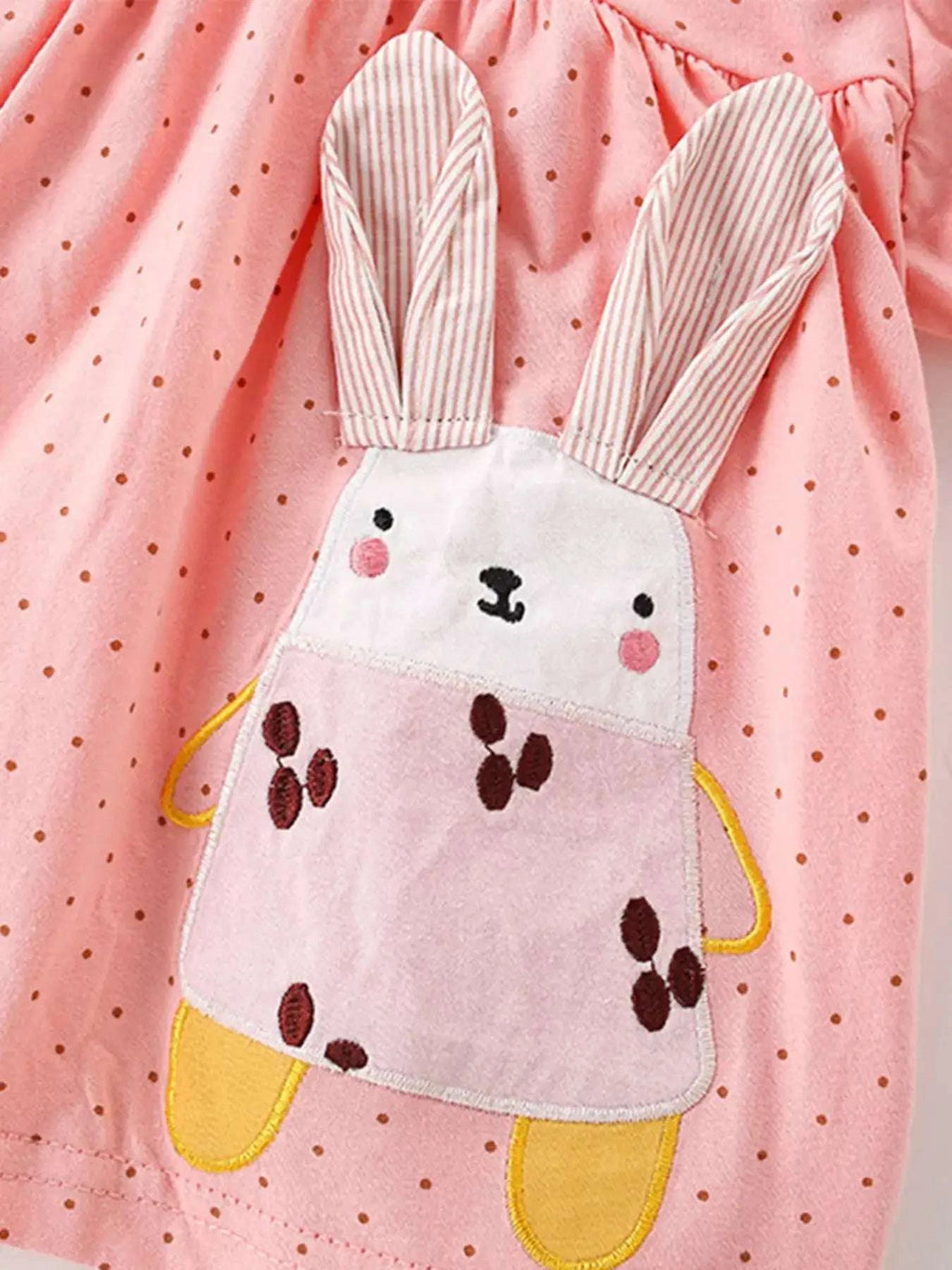Dusty pink polka dot top with bunny face applique and striped long ear details